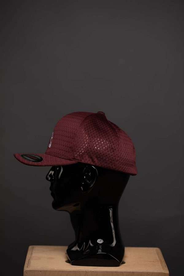 6777 Flexfit Hat Athletic Mesh Cap Maroon With White Ball Side View Flexfit Hat Athletic Mesh Cap