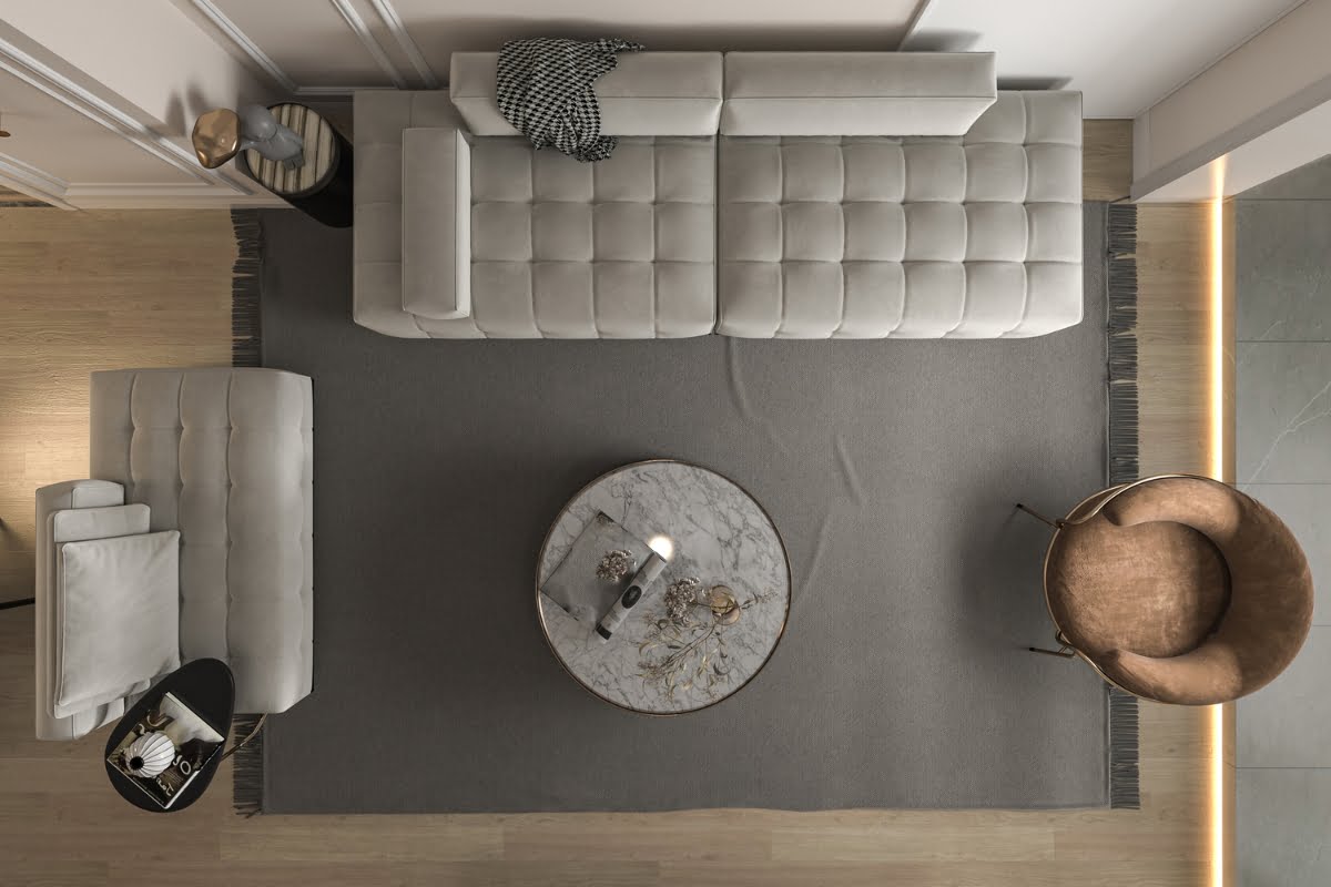 Top view of a modern living room with two gray sofas, a round marble coffee table, a brown chair, and a gray rug on a wooden floor, subtly incorporating golf home decor elements.