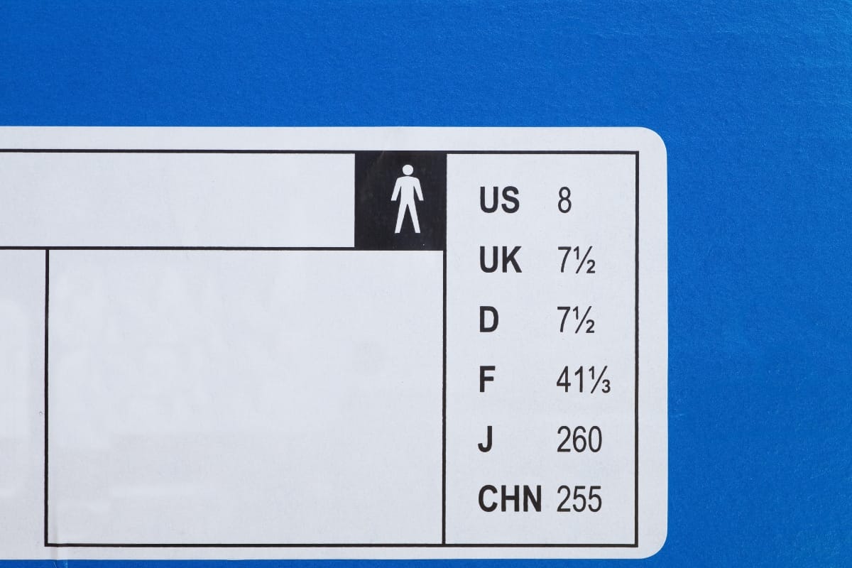 A shoe size chart on a blue background shows men's sizes: US 8, UK 7.5, D 7.5, F 41 1/3, J 260, CHN 255—ideal when pairing with the best golf shorts for your perfect fit.